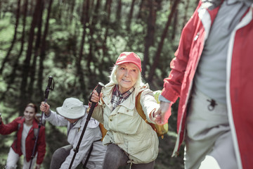 Nice coworkers practicing in ecotourism during teambuilding