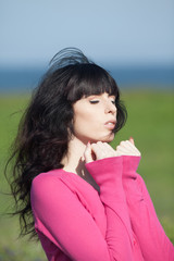 Fototapeta premium Portrait of young brunette woman outdoors
