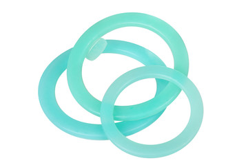 Green hydraulic and pneumatic o-ring seals isolated on white background. Rubber rings. Sealing gaskets for hydraulic joints. Rubber sealing rings for plumbing. 