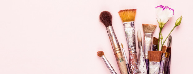 Set of old brushes, flower and palette knife, banner format