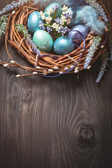 Happy Easter. Congratulatory easter background. Easter eggs and flowers. Background with copy space. Selective focus.