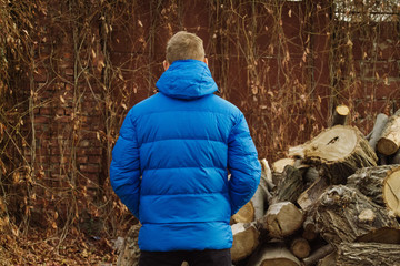 Male model in winter blue jacket posing