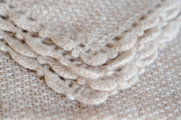 Fototapeta na wymiar Handmade woolen fabric close-up