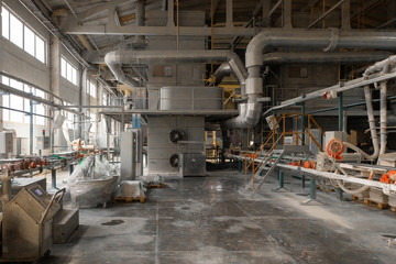 Fototapeta na wymiar Long dusty corridors inside the ceramic factory