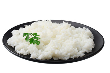 White rice in black bowl isolated on white background