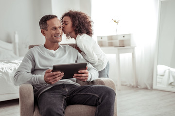 Smiling joyful man spending a day with daughter