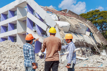 Engineer controls the work, smashing the building to create a new building - Image