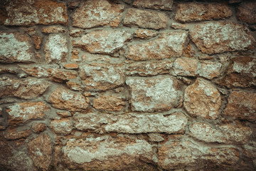 old wall of stone shell rock of arbitrary shape. toned image. background for titles