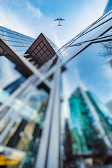 jet plane flying over architecture