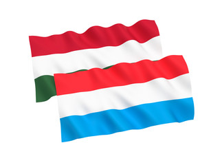 National fabric flags of Hungary and Luxembourg isolated on white background. 3d rendering illustration. 1 to 2 proportion.