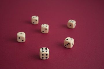 High angle view of dices on red background