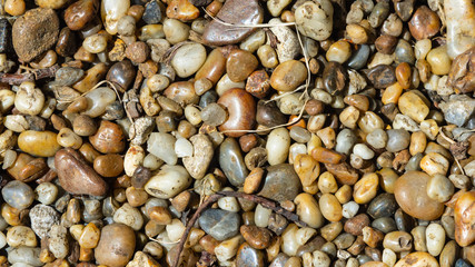Abstract pebble stones background texture macro, selective focus