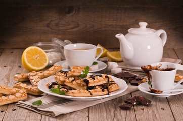 Puff pastry cookies with chocolate icing.