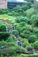 Water fall and flowers in the park.