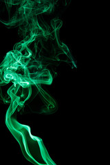Green smoke on black background
