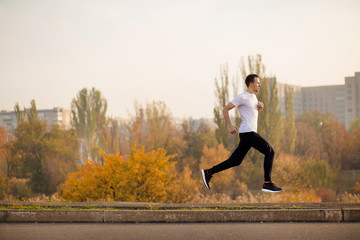 Man run at autumn morning. Healthy lifestyle