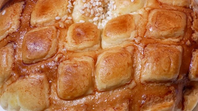 Rotating of pineapple bun on white background with 4k resolution.
