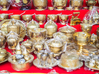 Group of Asian brass monk supply in the market or shop.