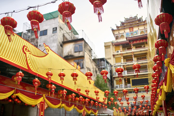 Asian city street decorated with traditional red chinese lanterns