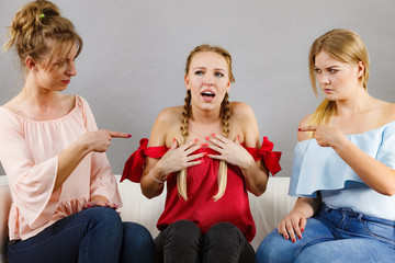 Woman being bullied by two females