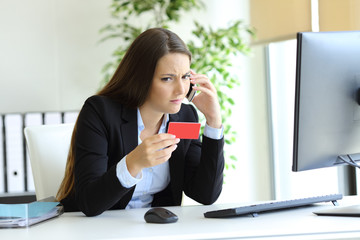 Confused woman calling bank about wrong credit card
