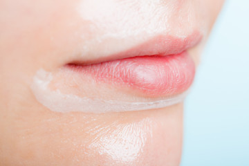 Close up woman in facial peel off mask.