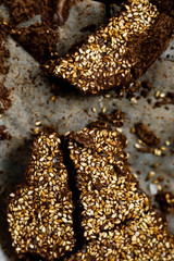 Closeup luxury handmade dark chocolate with seasame and sea salt, in paper