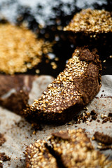 Fototapeta premium Closeup luxury handmade dark chocolate with seasame and sea salt, in paper