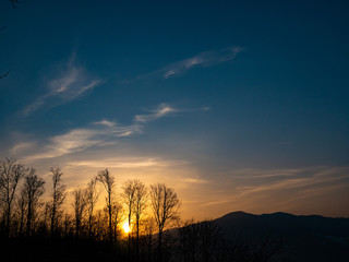 Amazing and beautiful view of the mountains in the rays of the setting sun