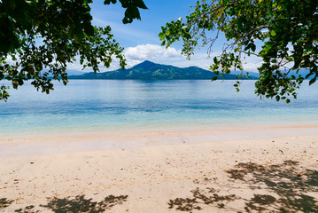 Beach on Siladen island in Bunaken National Marine Park, Sulawesi, Indonesia