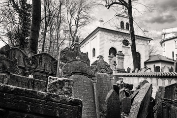 Tombstones in the Josefov cemetery in the old ghetto of Prague. The Jewish cemetery, with the uneven headstones carved in Hebrew, represents centuries of history that has been preserved