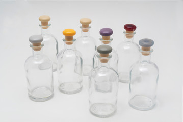 small glass bottles with colored cap