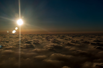 sun above the clouds, the view from the plane