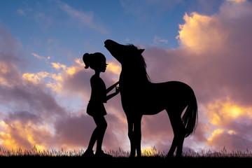 little girl and horse at sunset