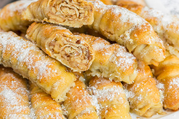 Baked sugar food dessert on wooden plate. Cookies and pastry