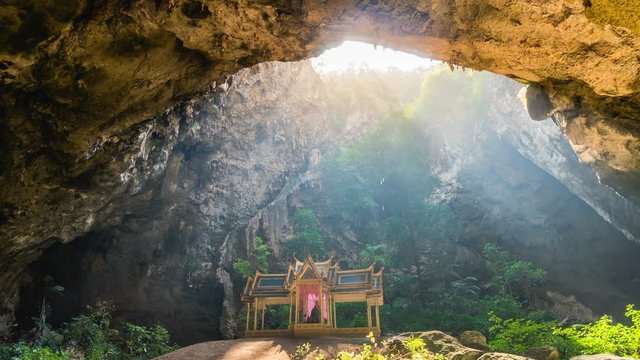 Time Lapse of Amazing Phraya Nakhon cave in Khao Sam Roi Yot national park at Prachuap Khiri Khan Thailand is small temple in the sun rays in cave.