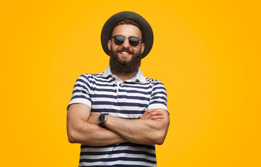 Handsome happy man in sunglasses and hat