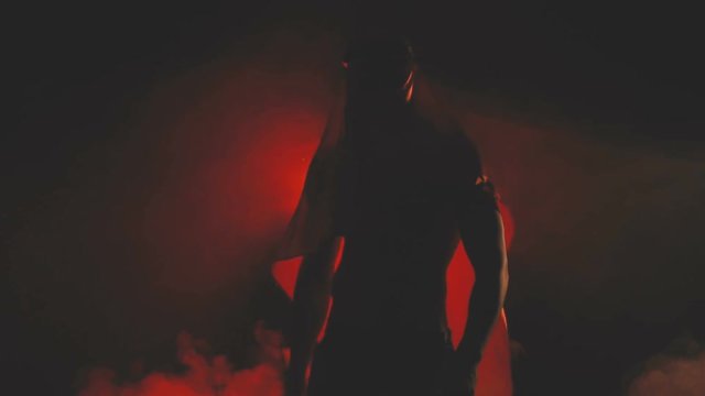 Silhouette of a dancing sexy man