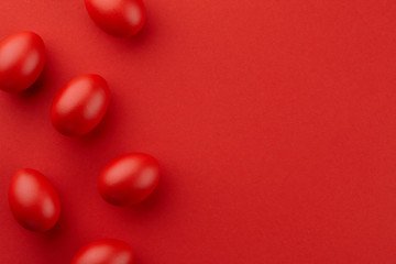 Vivid red Easter eggs on red background - 250210364