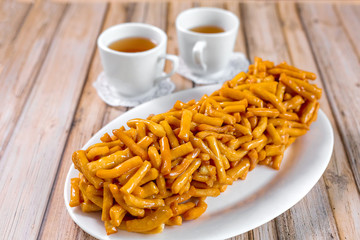 Baked sugar food dessert on wooden plate. Cookies and pastry
