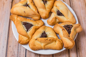 Baked sugar food dessert on wooden plate. Cookies and pastry