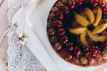 Cherry delicious tasty baked pie with fresh fruits on white plate