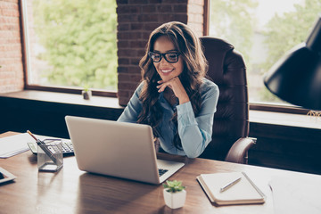 Close up photo beautiful she her business lady got promotion look screen speak skype sit big office chair working chatting investors hear good news glad answer wearing specs formal wear suit shirt