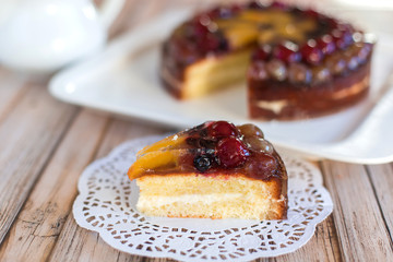 Cherry delicious tasty baked pie with fresh fruits on white plate