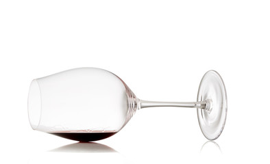 Glass with red wine on white background