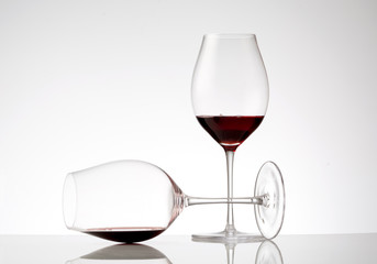 Two glasses of red wine on white background