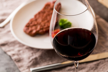 Closeup of Red Wine and Steak Dinner 