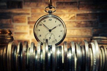 Time is money concept.Old coins and clock.Numismatics and collecting money.Russian Empire and world...