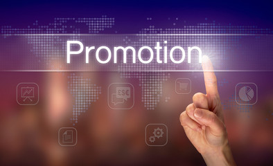 A hand selecting a Promotion business concept on a clear screen with a colorful blurred background.