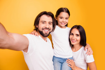 Self-portrait of nice cute lovely attractive charming cheerful cheery people mommy daddy pre-teen girl having fun day daydream isolated over shine vivid pastel yellow background